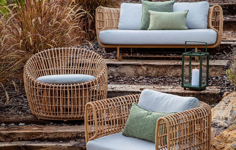 Cosy comfortable outdoor lounge area with weave outdoor furniture