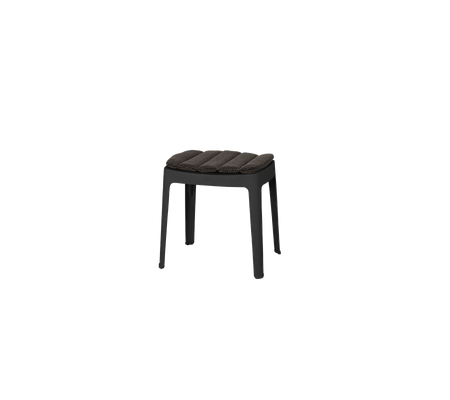 A sleek, minimalist stool with a padded seat and sturdy legs, perfect for versatile seating options in various settings.
