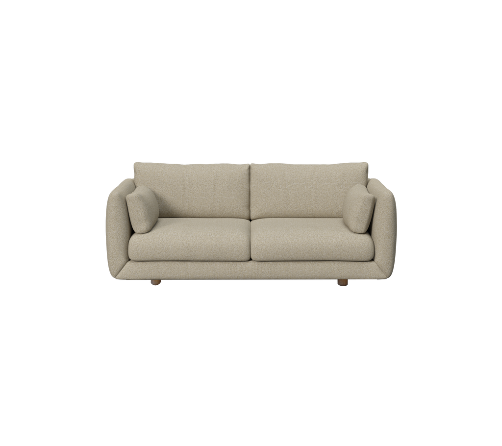 Modern brown sofa with rounded cushions in a lounge setting.