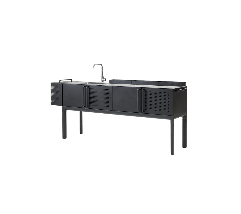 Modern grey countertop with black cabinet in a kitchen setting.