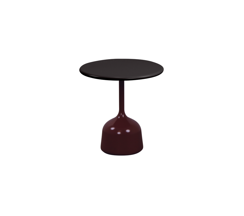 Burgundy table with a round top in a modern design.
