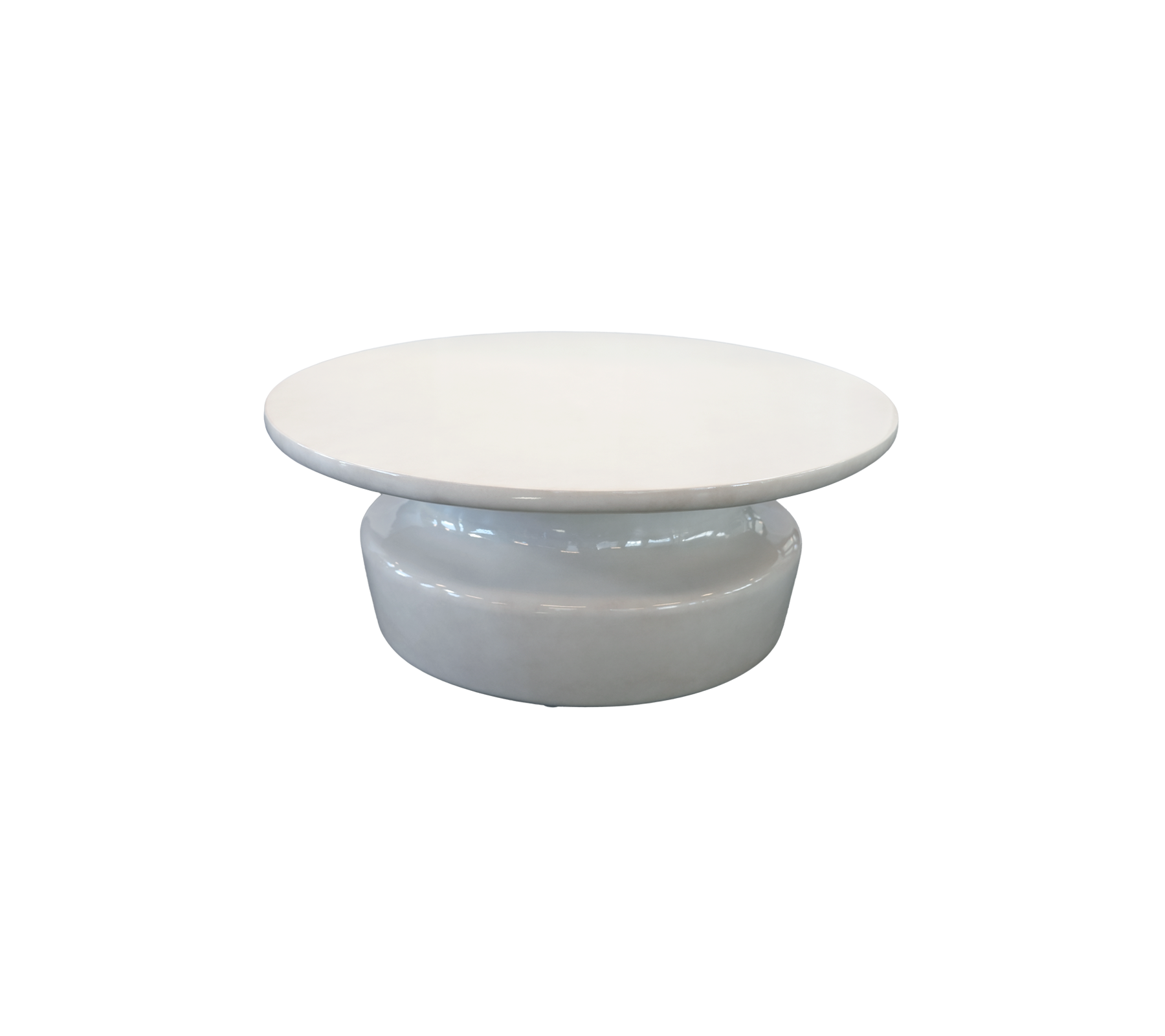 Modern white coffee table with a round top and a curved base.