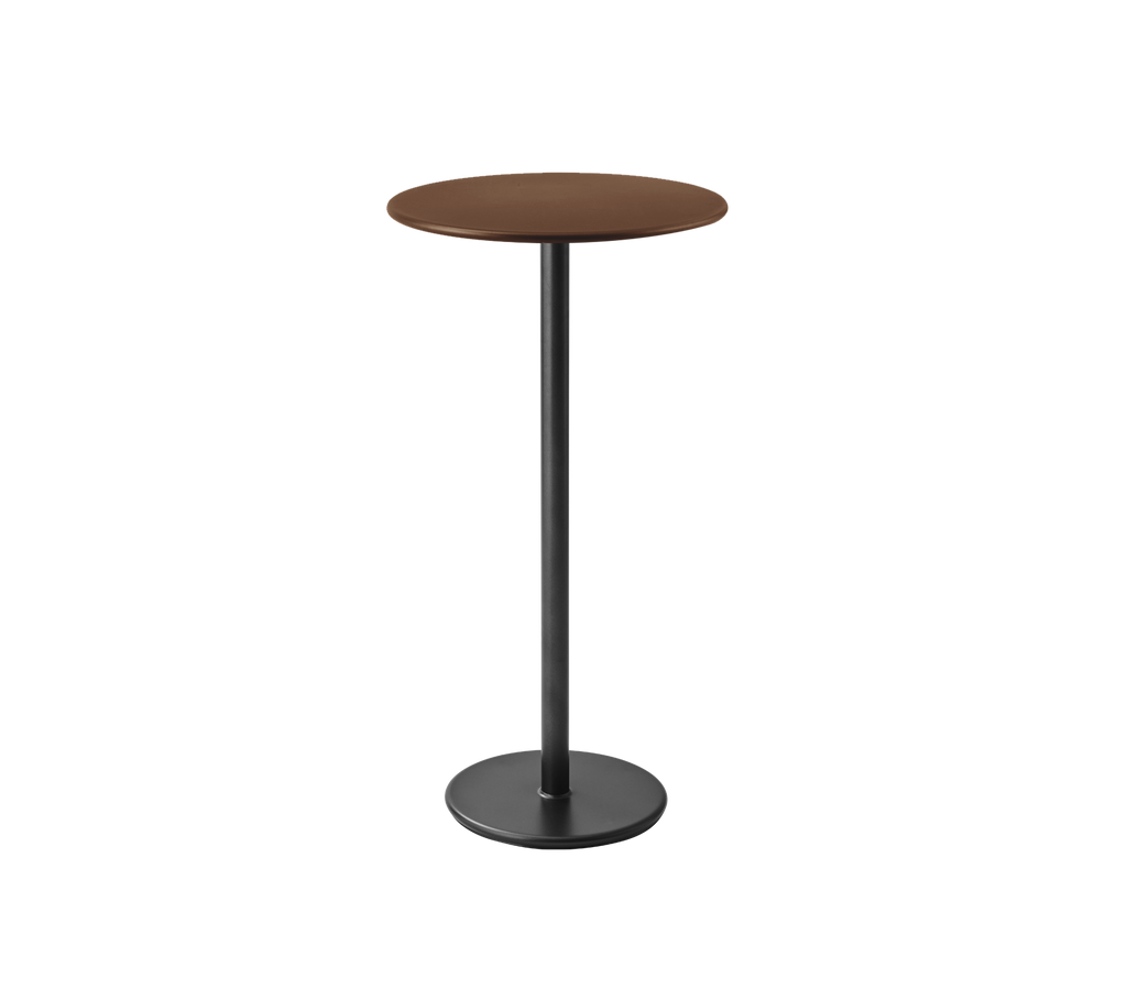 A simple brown table with a round top and a black base.