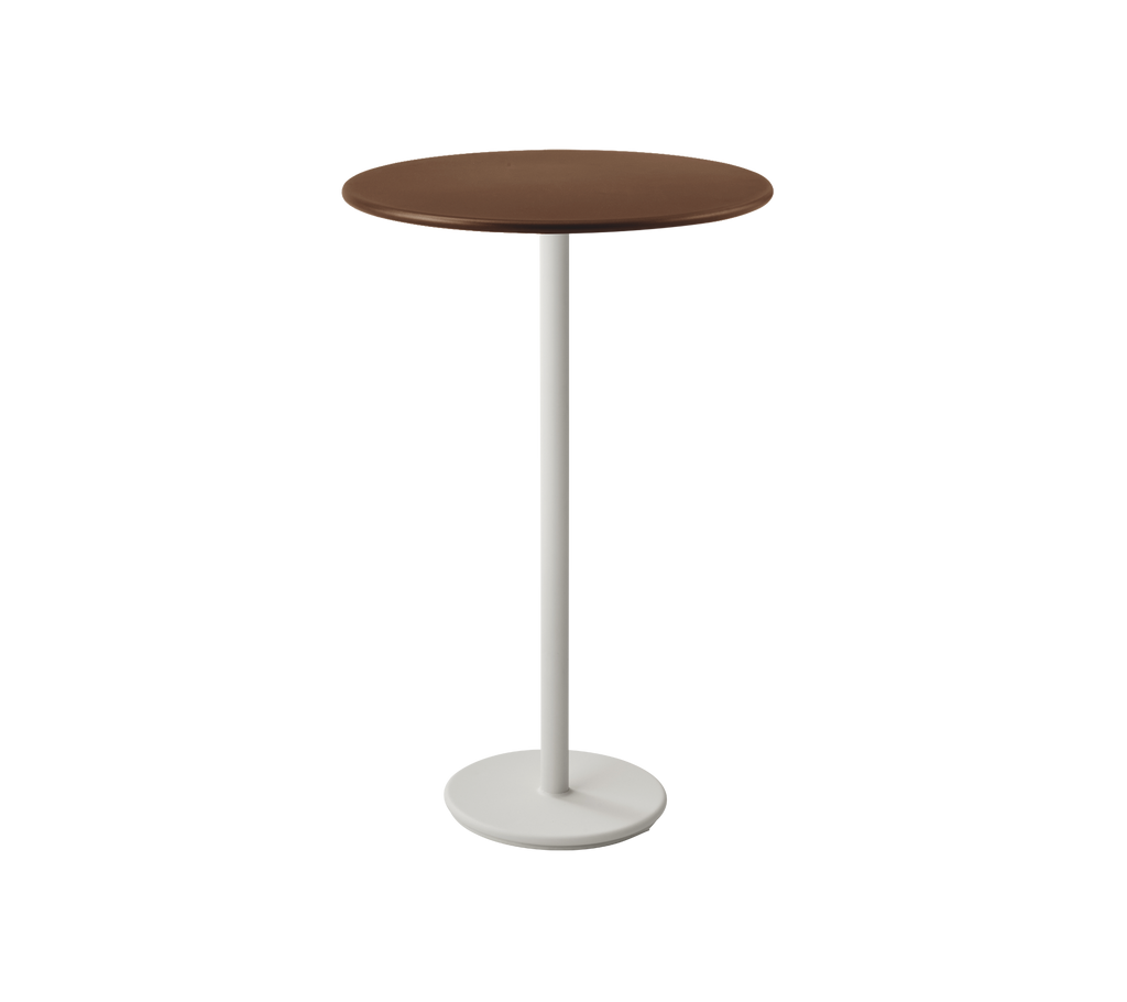 Brown round table on a white pedestal base.