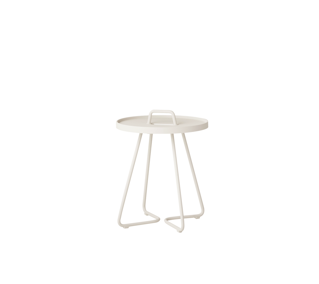 Sand side table with a minimalist design and sleek lines.