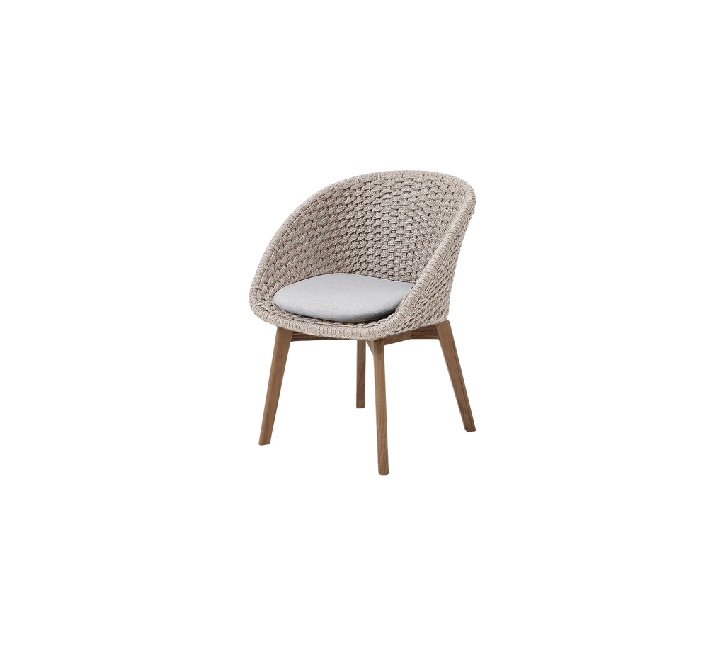 Modern sand chair with light grey cushion.
