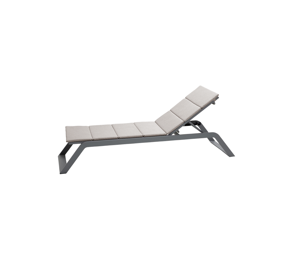 Modern lounge chair in light grey with a sleek design.