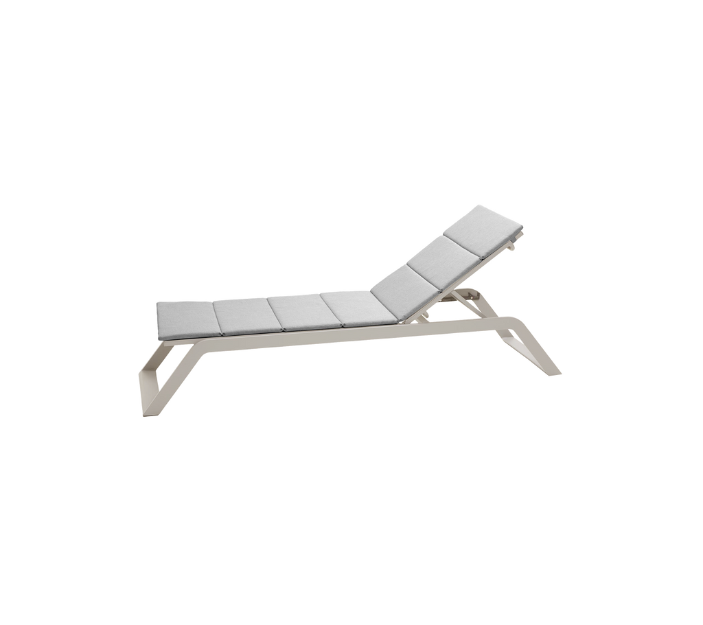 Light grey lounge chair with a sleek design in a modern style.