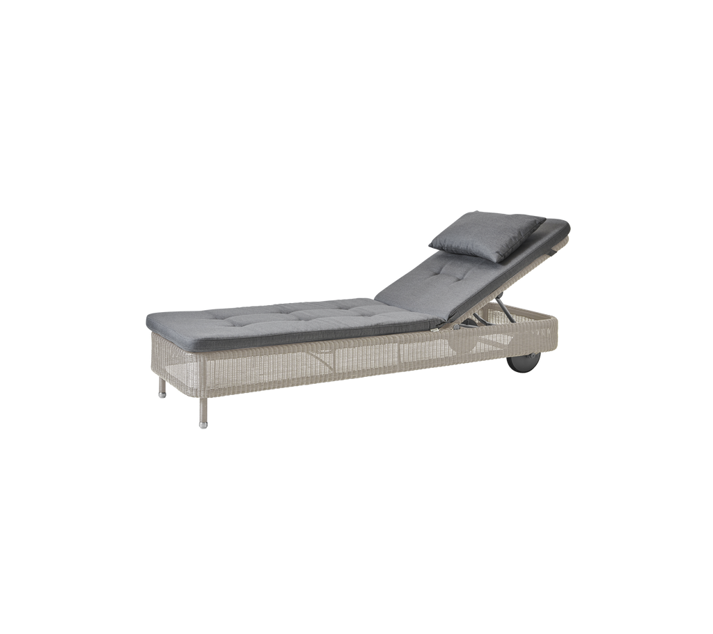 Modern grey chaise lounge with a sand cushion.