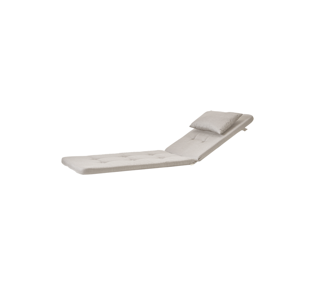 Sand-colored chaise lounge with a headrest cushion.