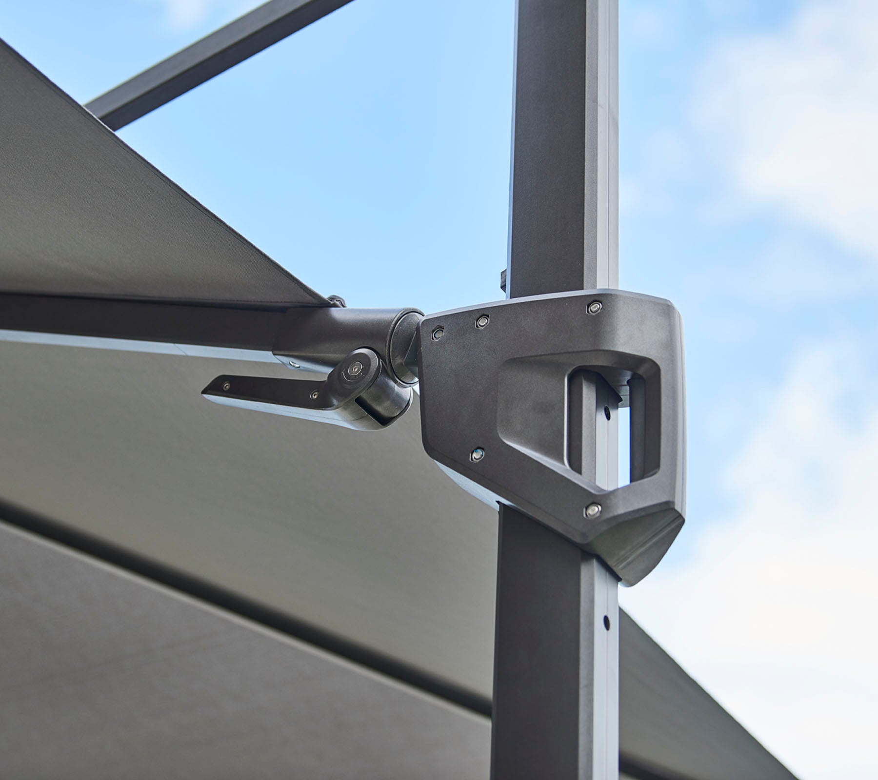Adjustable hardware attachment for a shade structure, showcasing a sleek metallic design and functional mechanics.