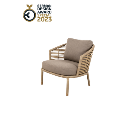 Stylish chair with a woven design and plush cushion, awarded the German Design Award 2023.