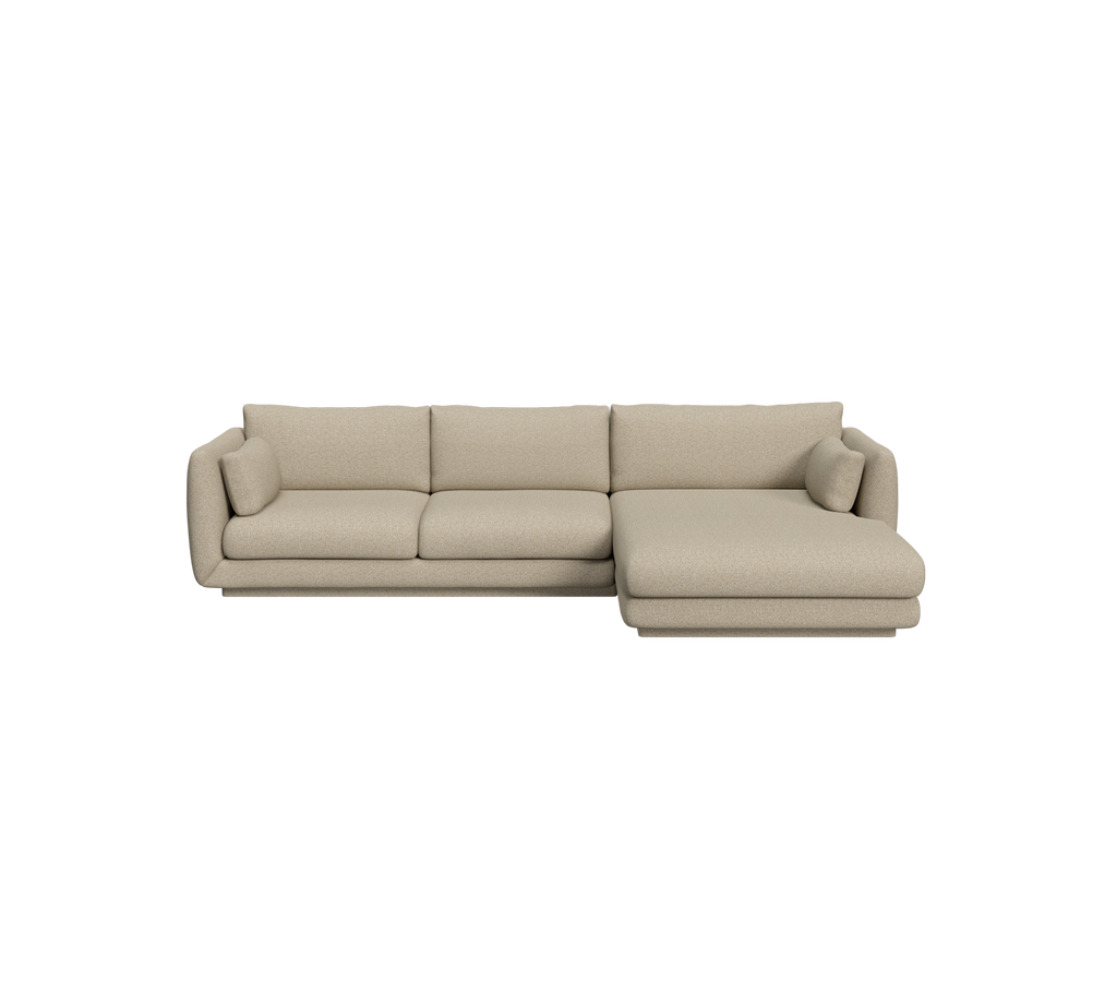 Brown modern sofa with a chaise in a lounge setting.