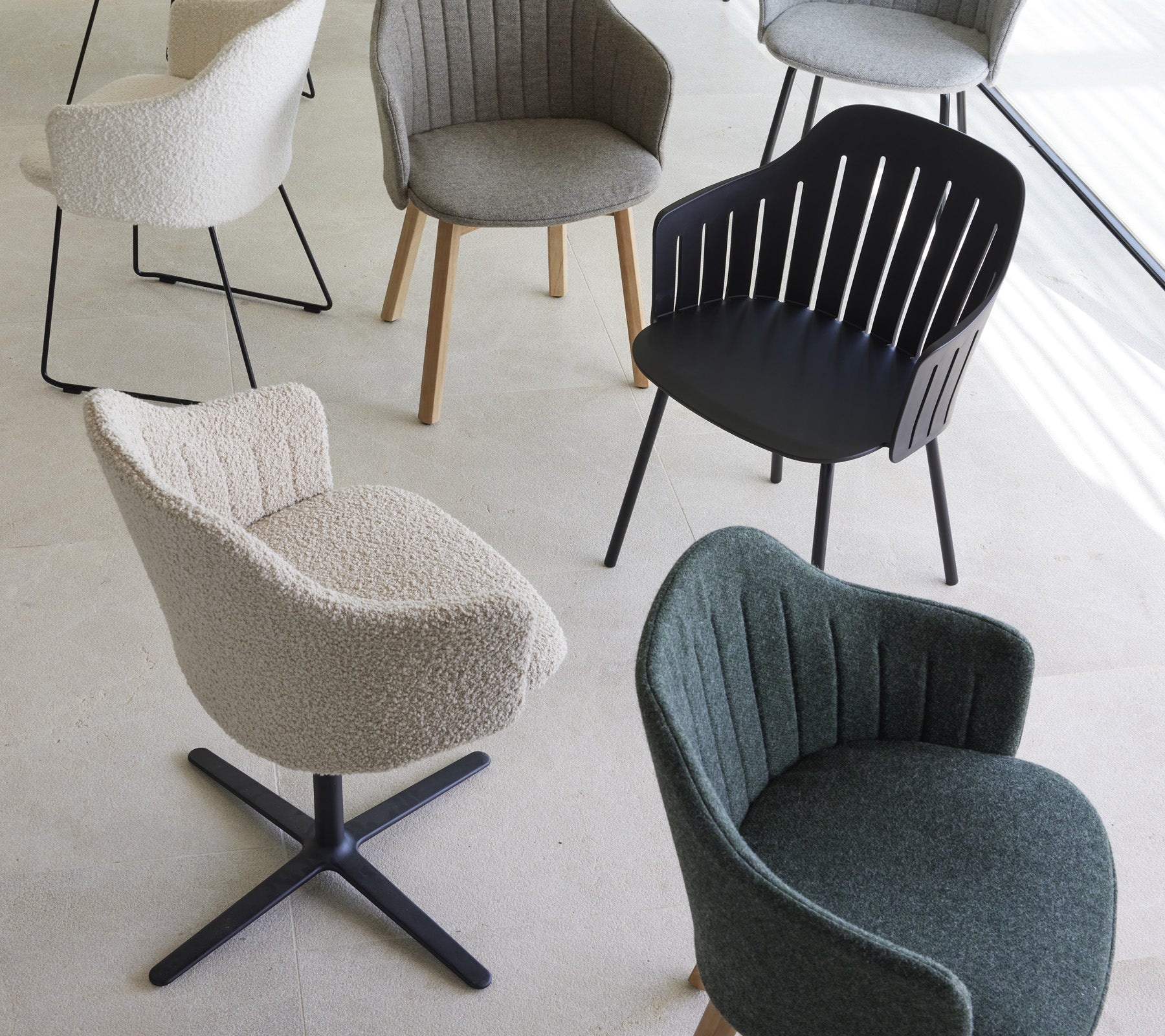 A collection of stylish chairs in various designs and colors, featuring unique textures and shapes, suitable for modern living spaces.